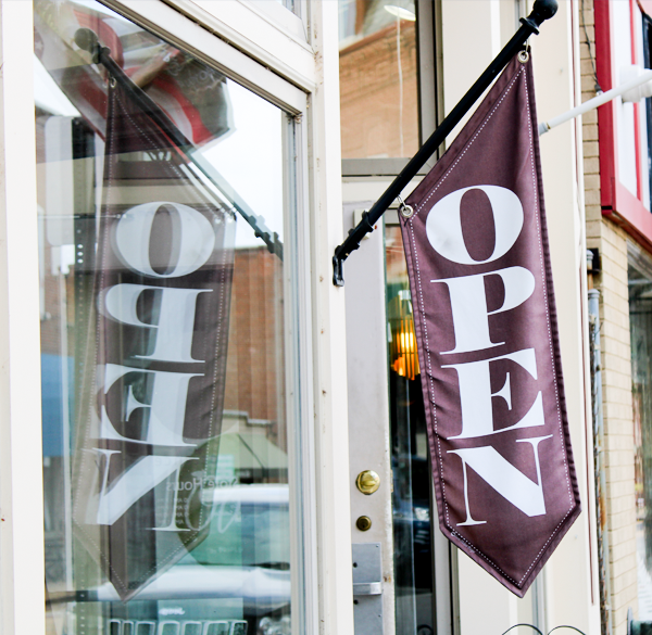 open sign on a main street business