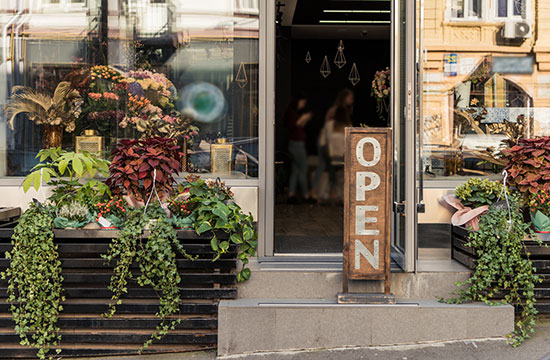 Open sign in front of a small business