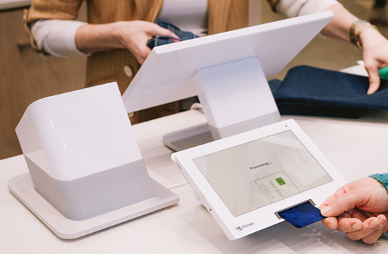 customer using a debit card with a chip to pay at a register